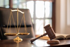 Courtroom or law office imagery with a gavel and balance scale, representing a civil law claim and the legal process in Pennsylvania.